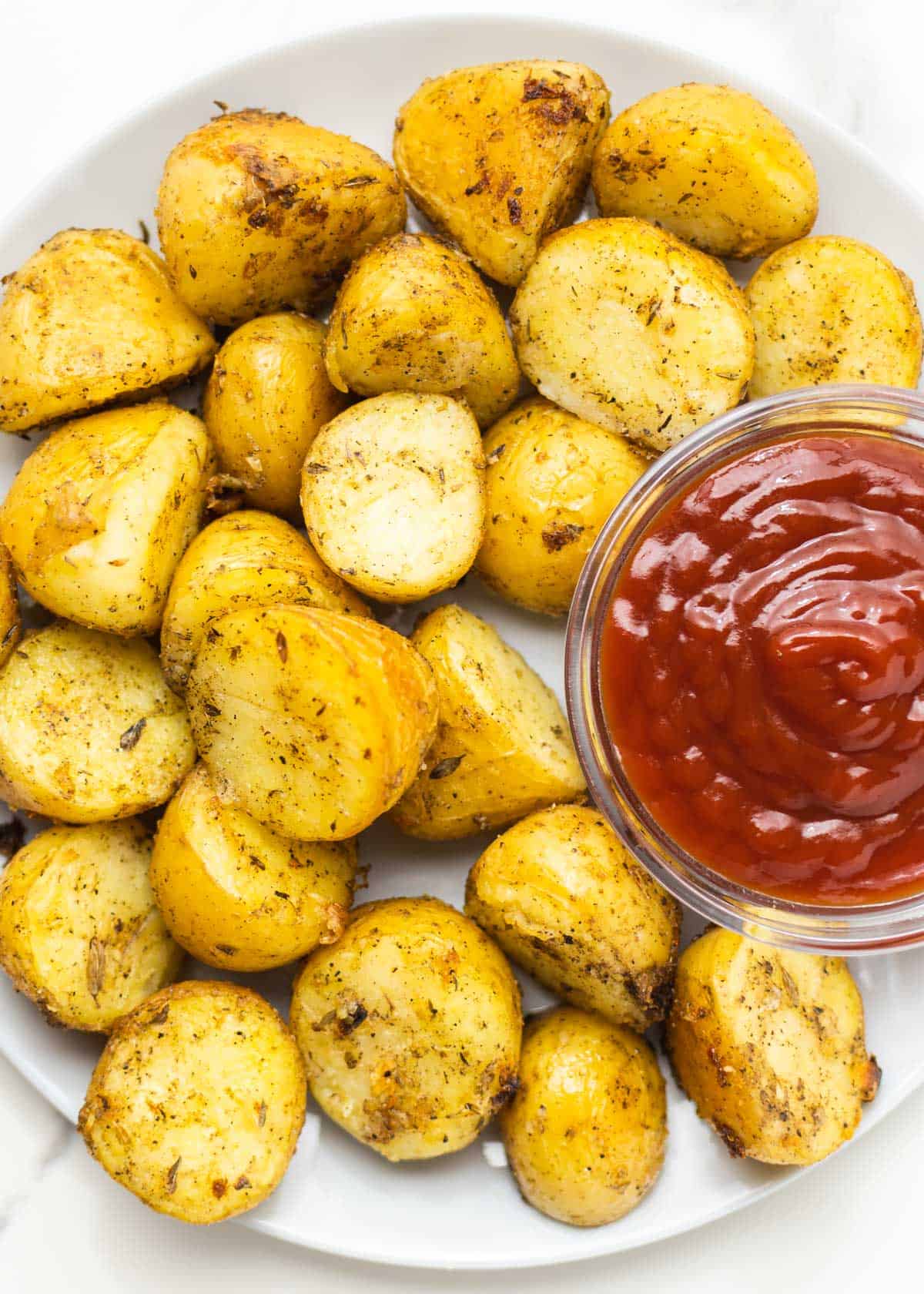 oven roasted yukon gold potatoes on a white dish