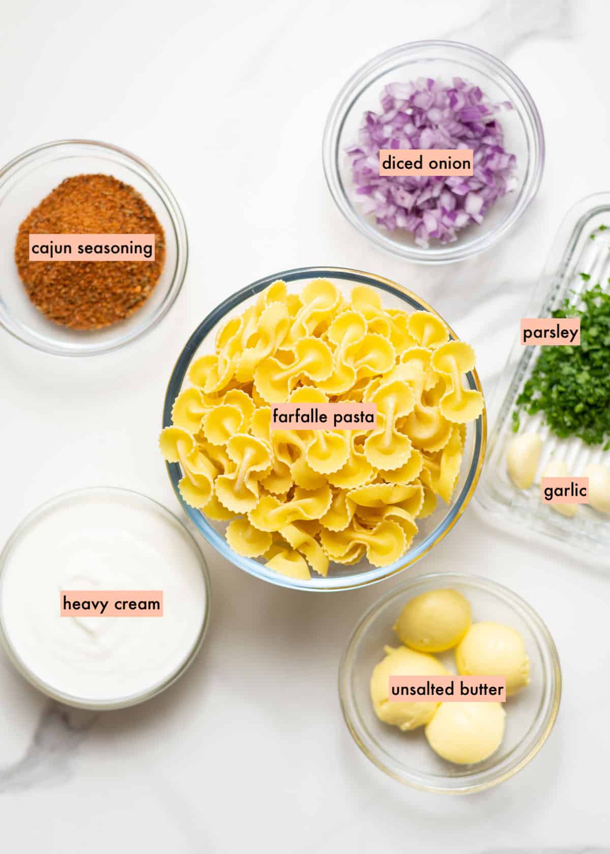 Ingredients to make cajun alfredo sauce on countertop.