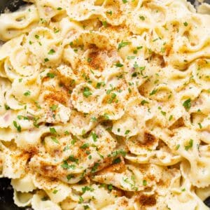 cajun farfalle pasta with chopped parsley.