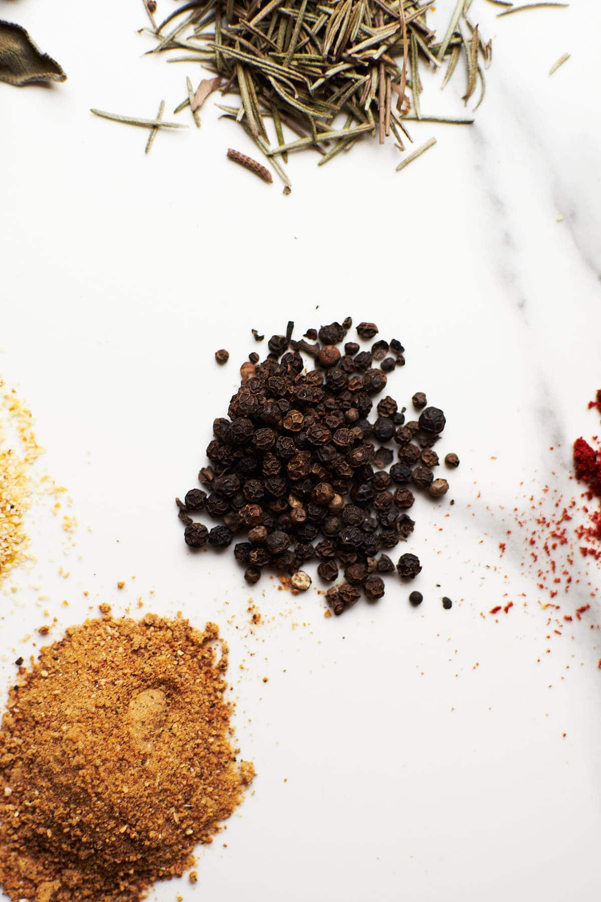 closeup of black pepper grains.