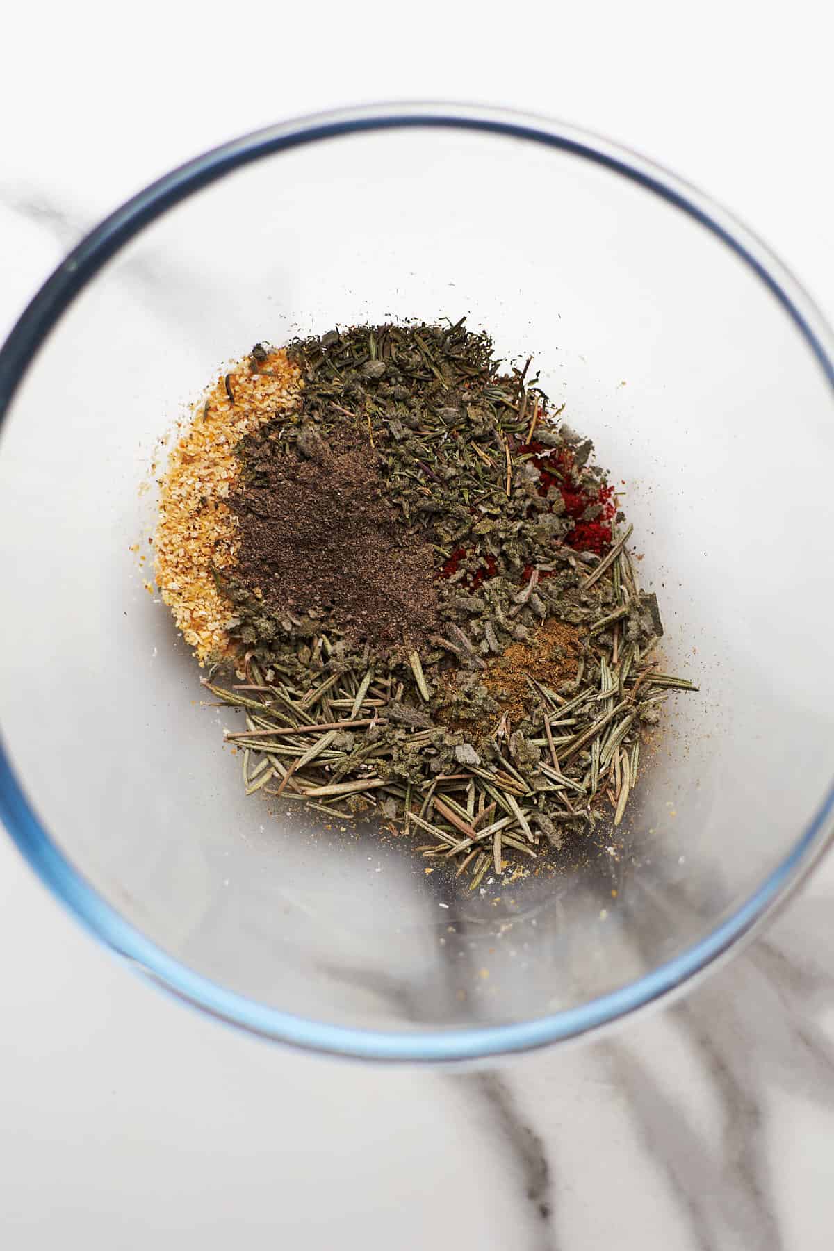 seasoning for spaghetti sauce on glass bowl.