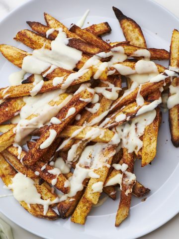 louisiana voodoo fries with cajun seasoning, and cheese sauce.