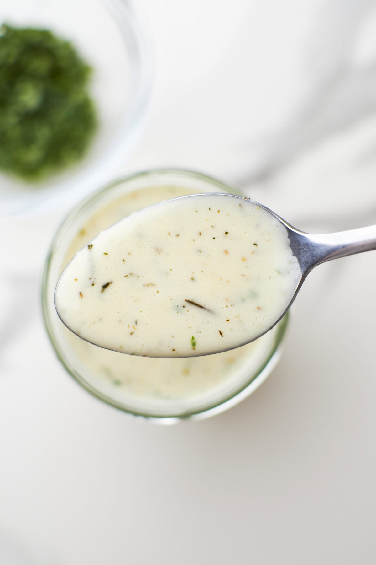 Overhead shot of a mason jar filled with garlic Parmesan cream sauce.