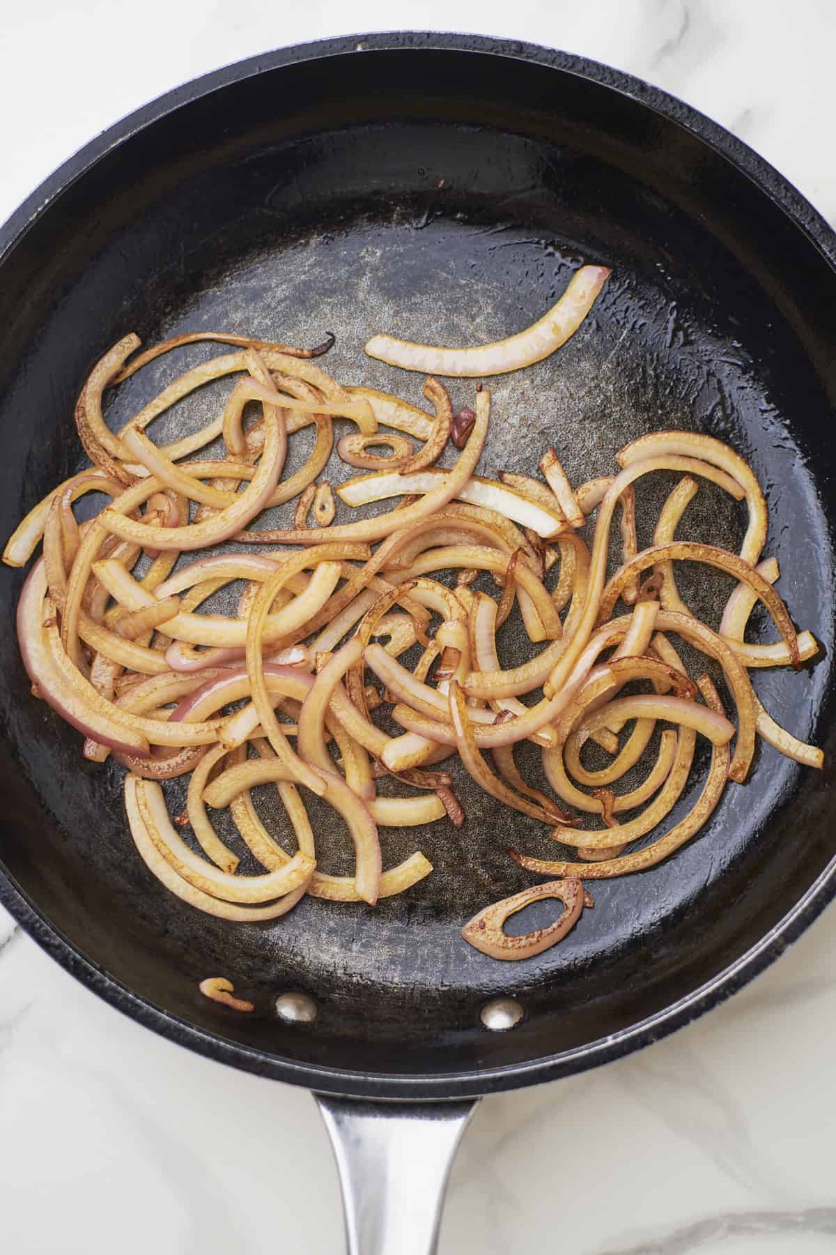 Caramelized onions in a skillet.