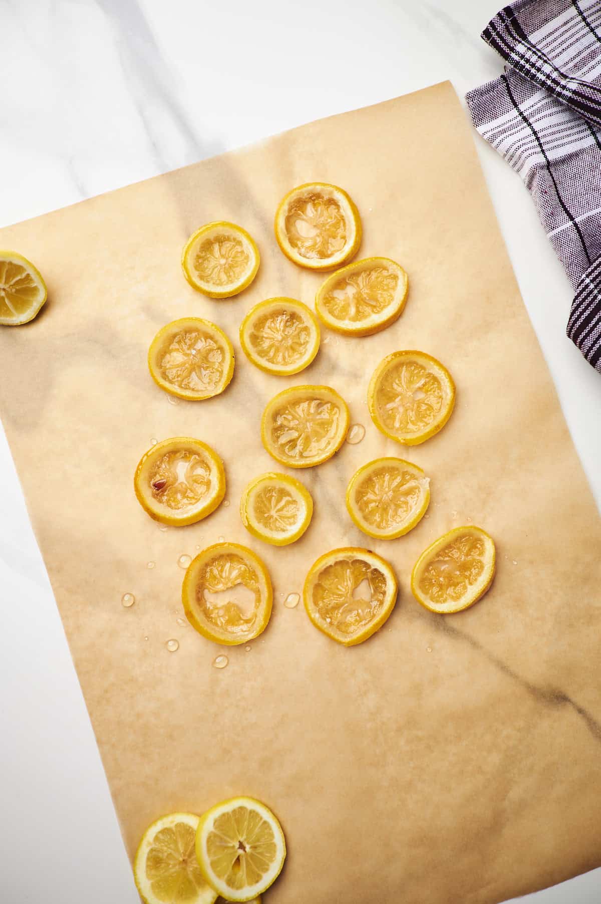 candied lemon slices on parchment paper.