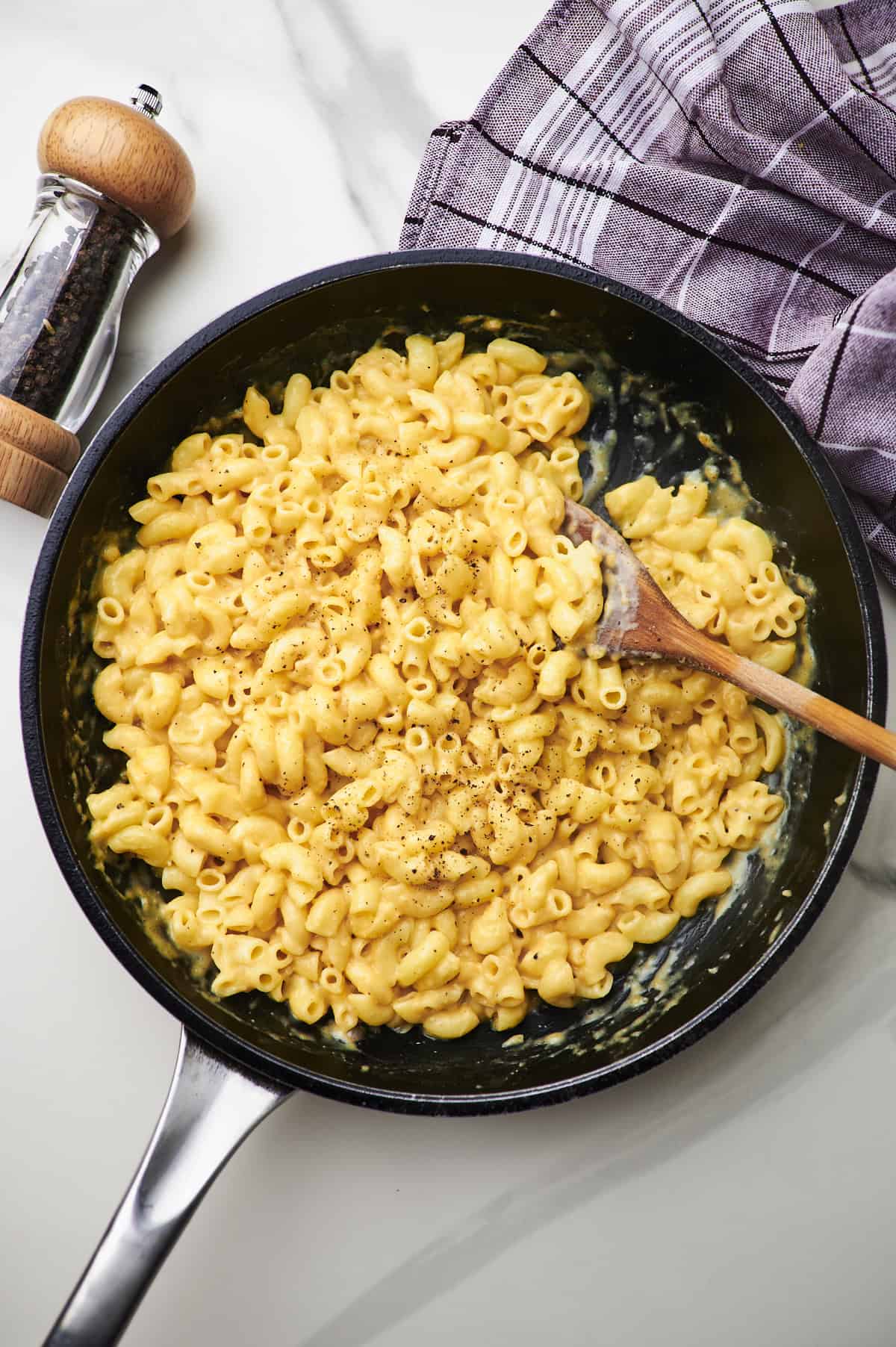 Stirring a pot of cottage cheese mac and cheese.