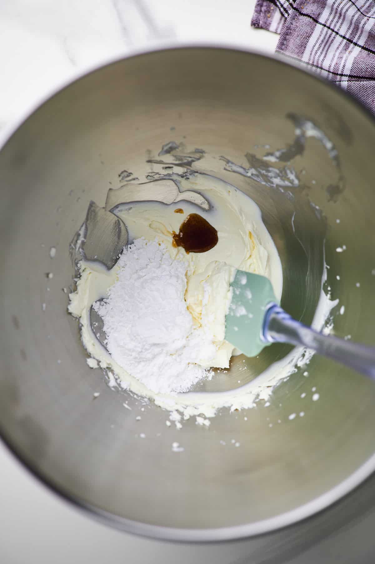 cream cheese, powdered sugar, and vanilla extract in a large bowl