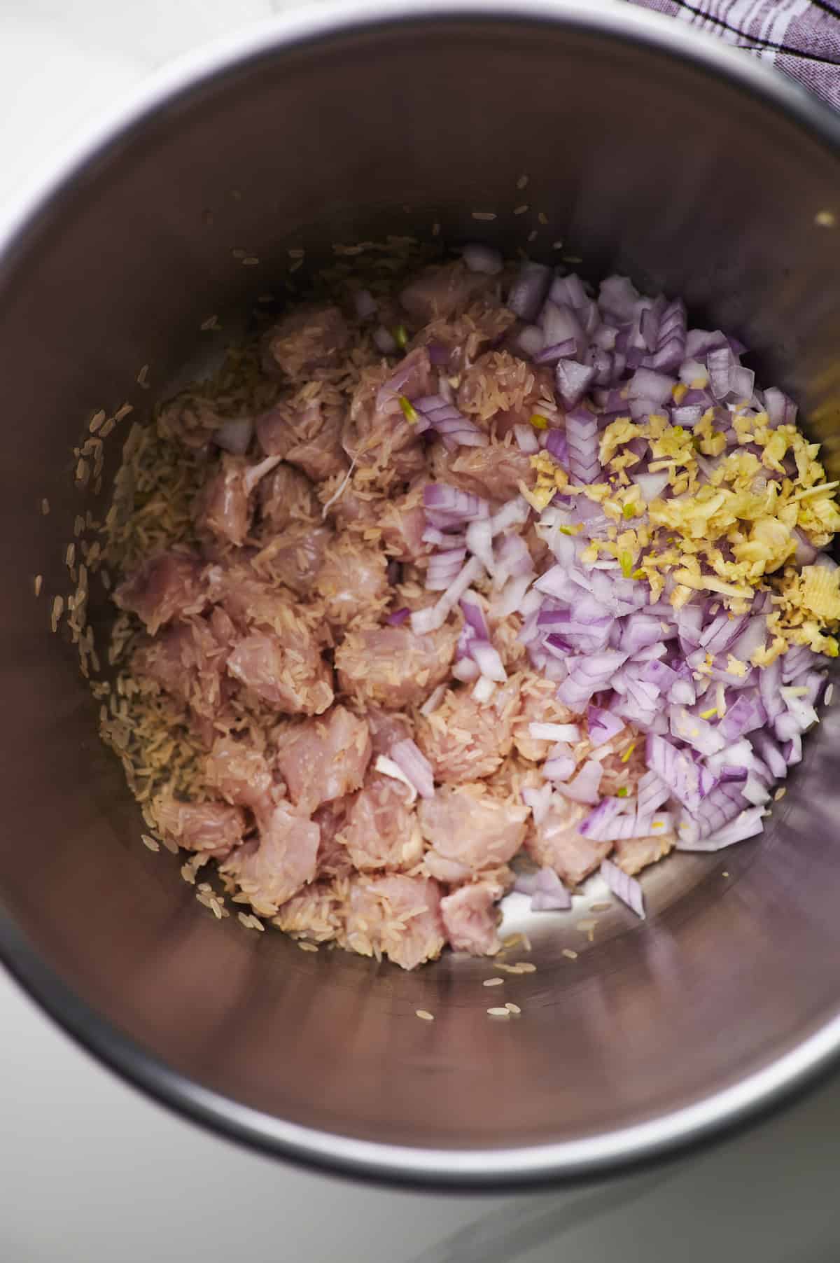 chicken rice, onion and garlic in crockpot.