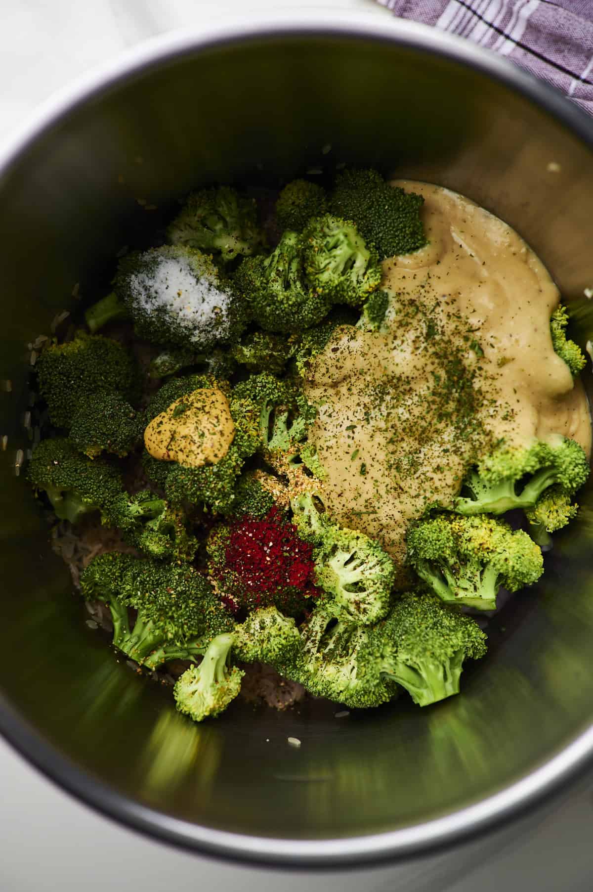 chicken, broccoli, rice, spices and cream of chicken soup in crock pot.