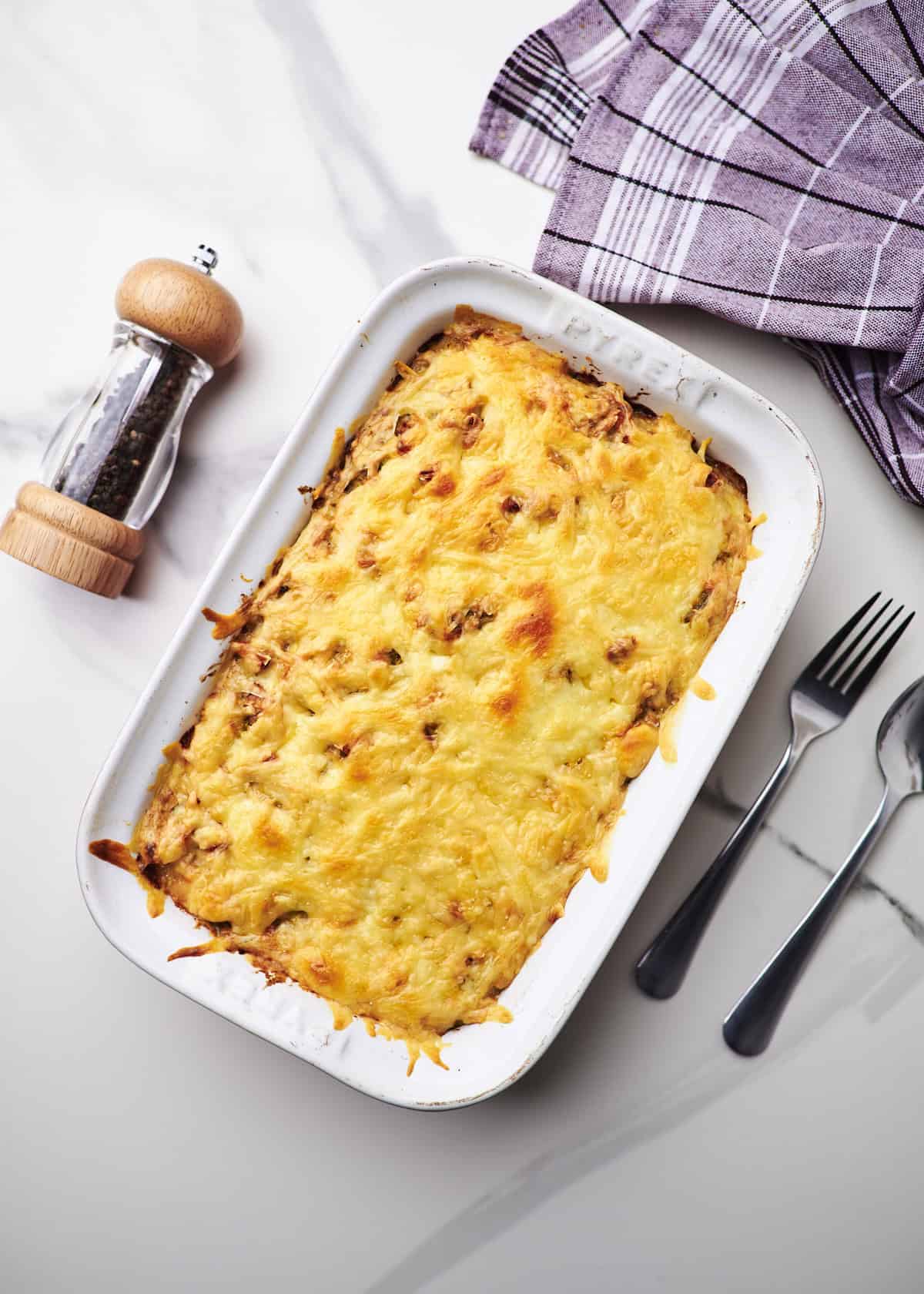 cheesy chicken broccoli and rice casserole in serving dish.