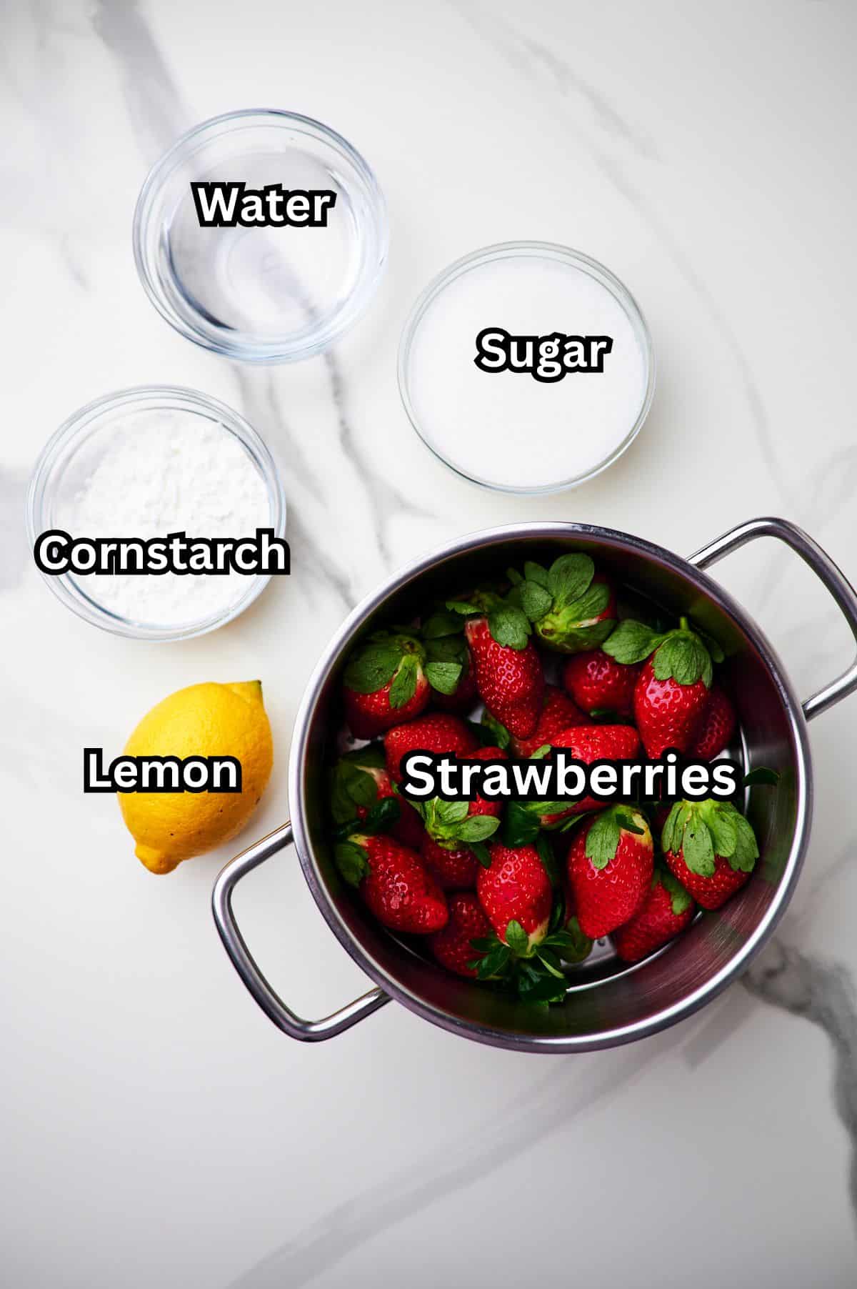 ingredients for strawberry cake filling on countertop.