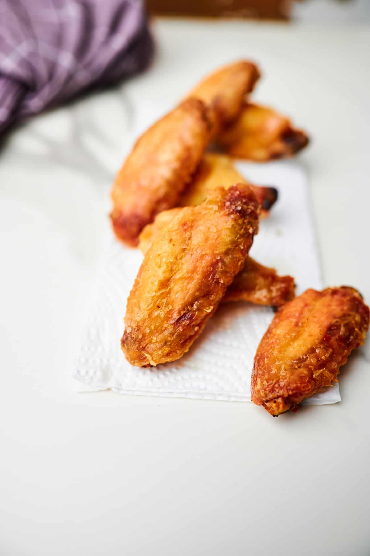 These crispy oven baked wings are so crispy, you will think they've been deep fried! You will be shocked how easy these are to make! 