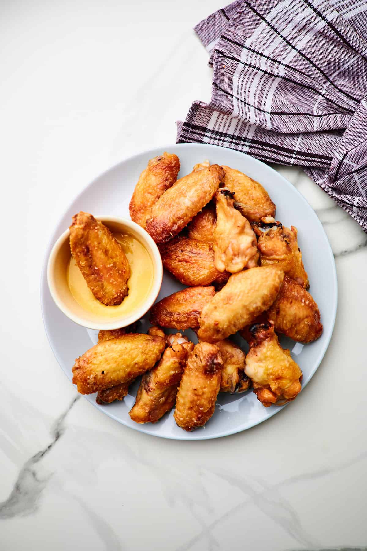 These crispy oven baked wings are so crispy, you will think they've been deep fried! You will be shocked how easy these are to make! 