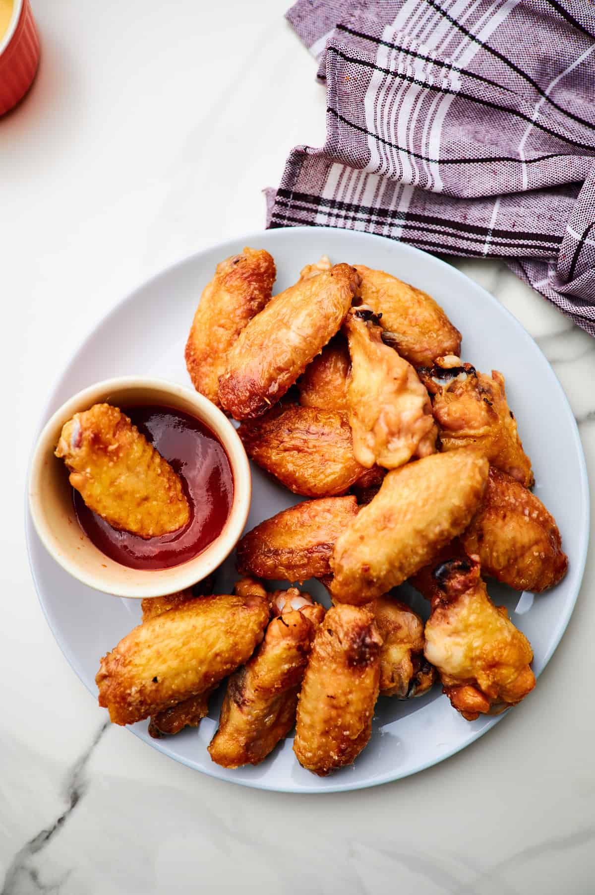 These crispy oven baked wings are so crispy, you will think they've been deep fried! You will be shocked how easy these are to make! 