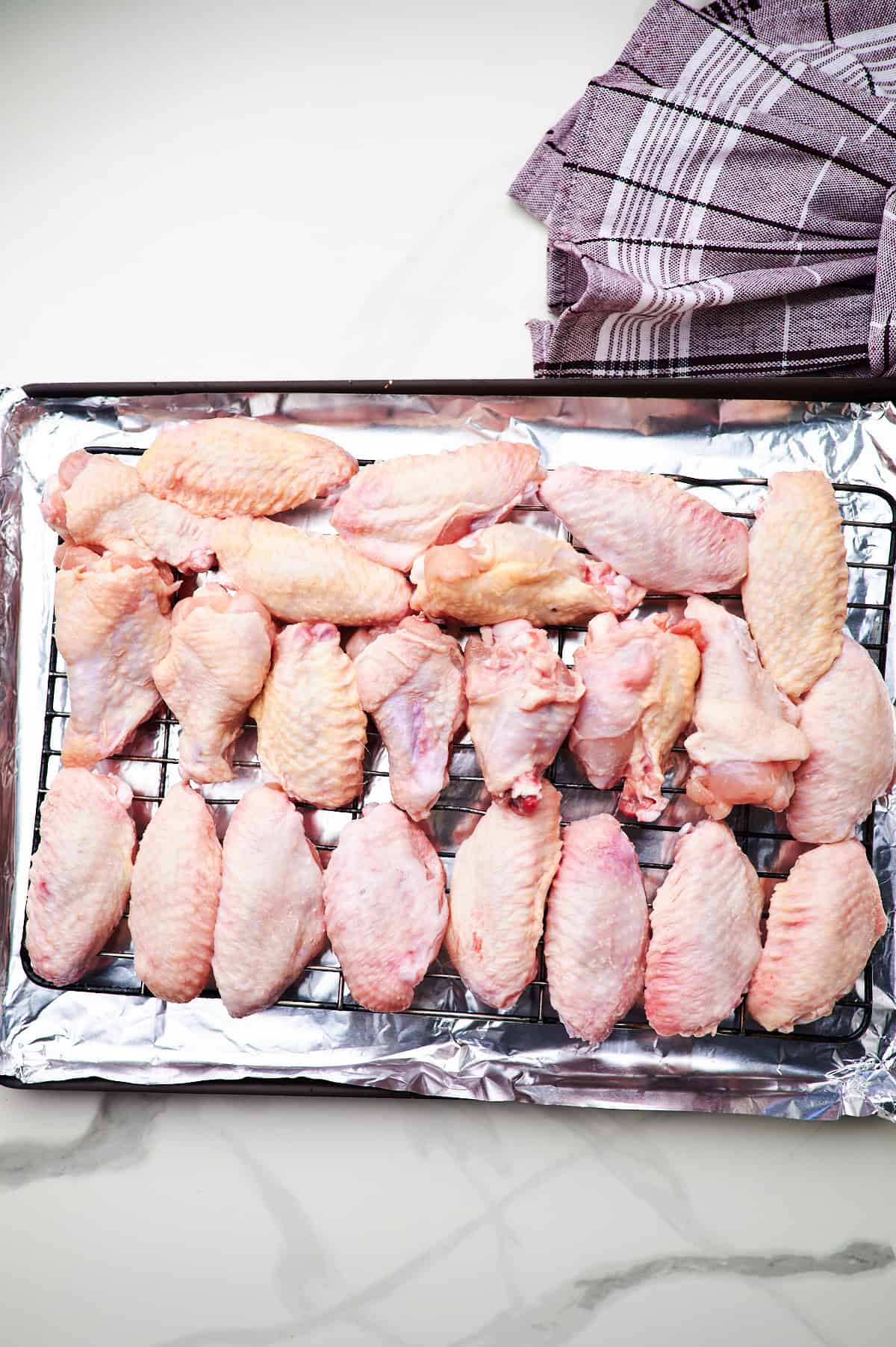 These crispy oven baked wings are so crispy, you will think they've been deep fried! You will be shocked how easy these are to make! 