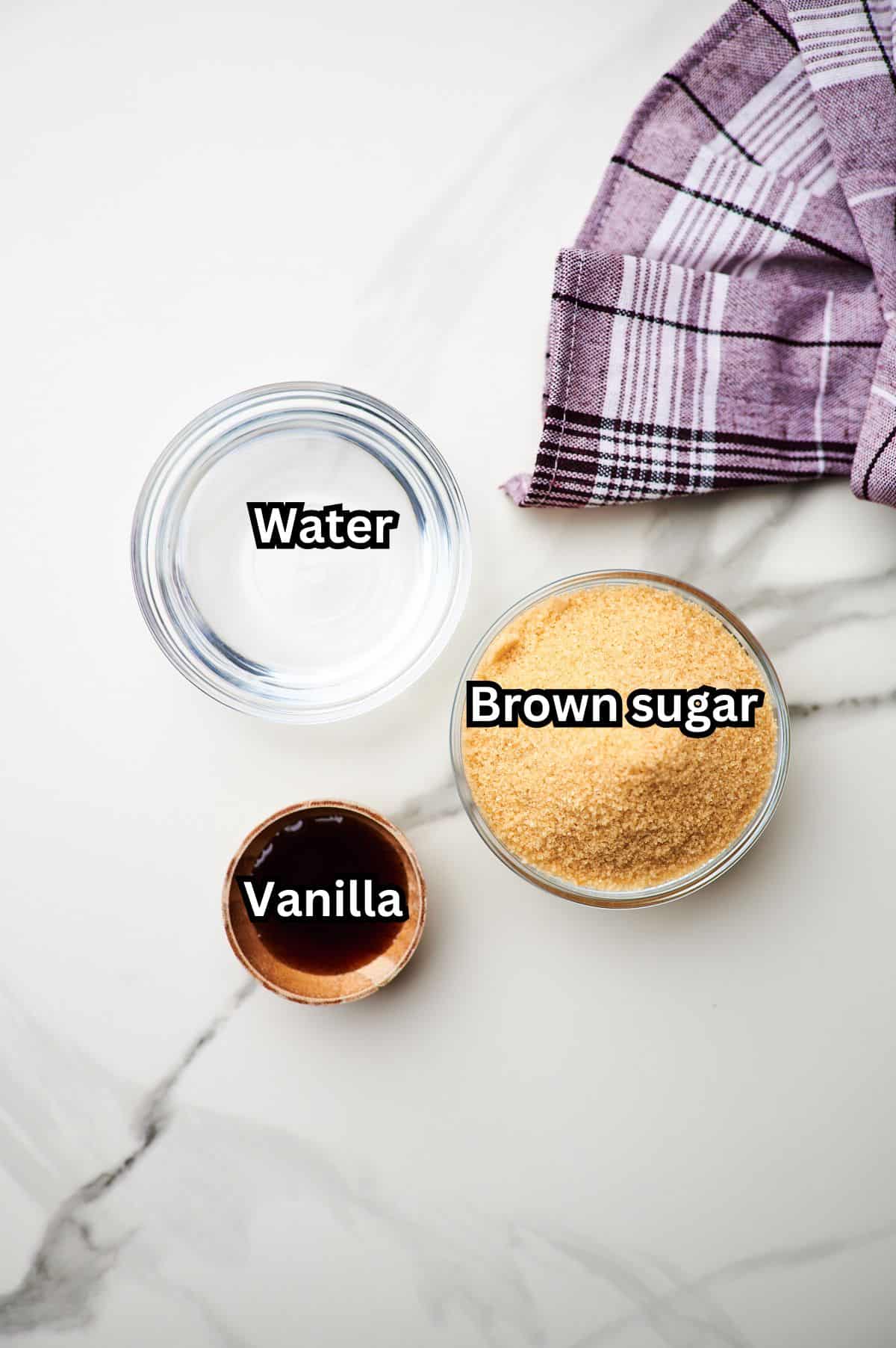 Water, brown sugar and vanilla extract in measuring containers.