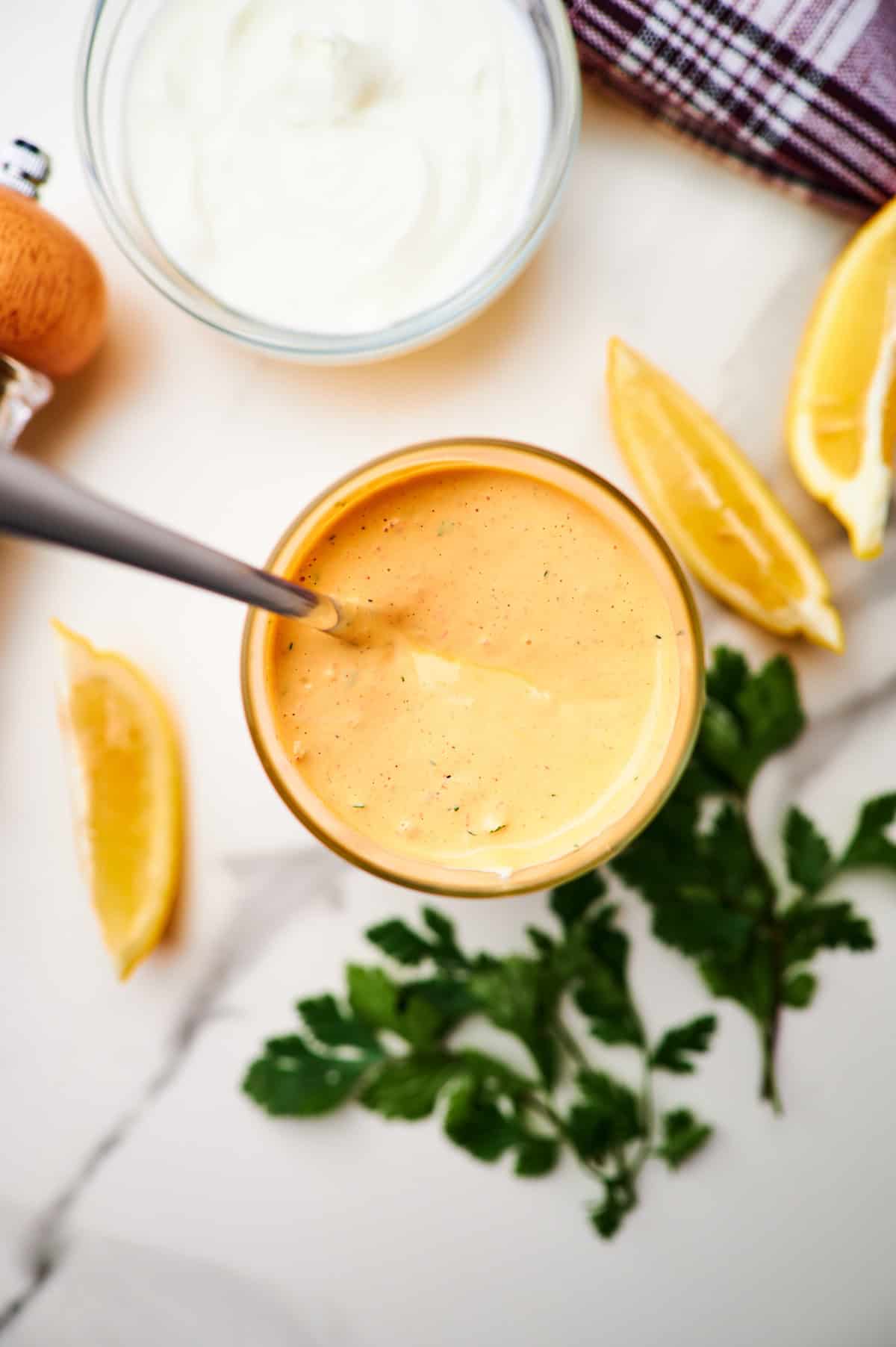 a jar with a spoon and homemade chipotle ranch dressing