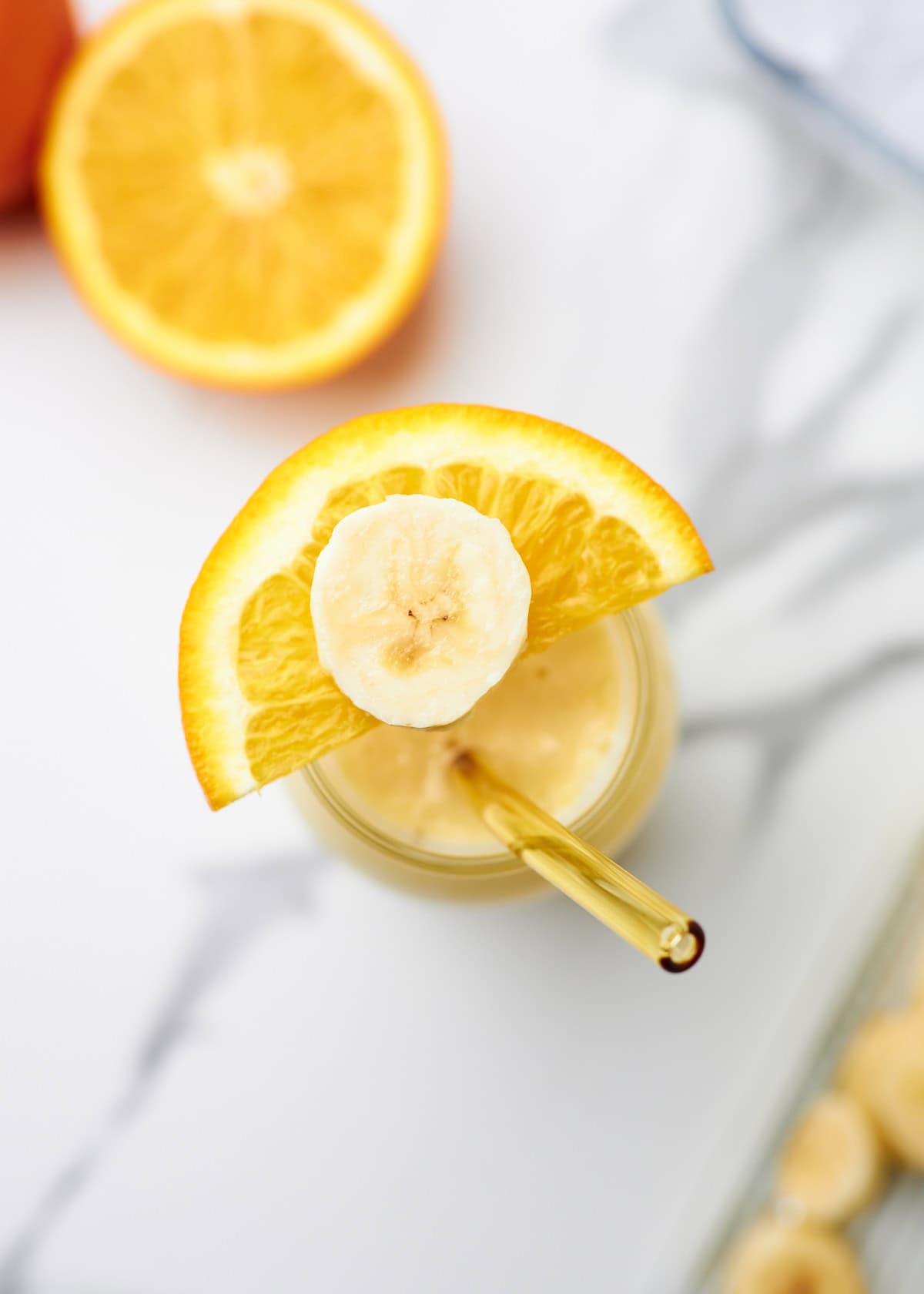 overhead shot of an orange banana smoothie