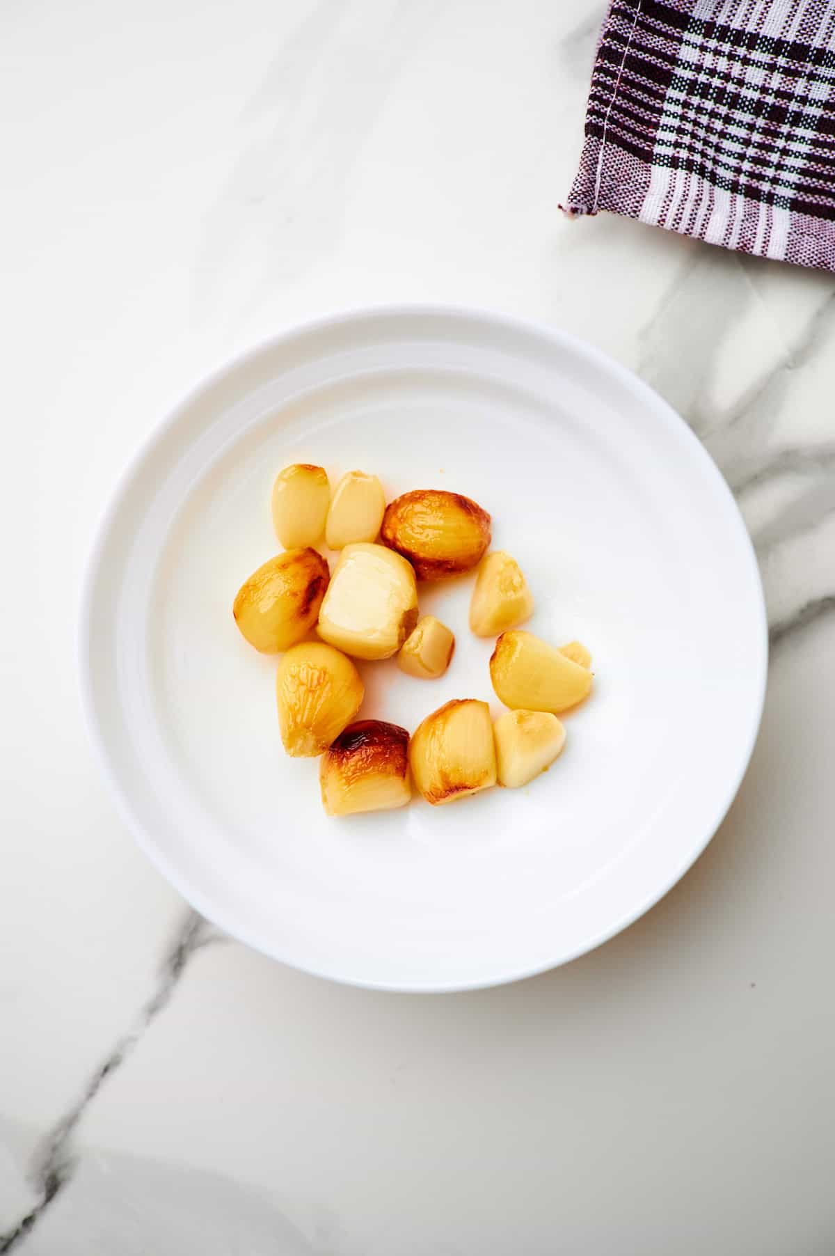 roasted garlic cloves in bowl.