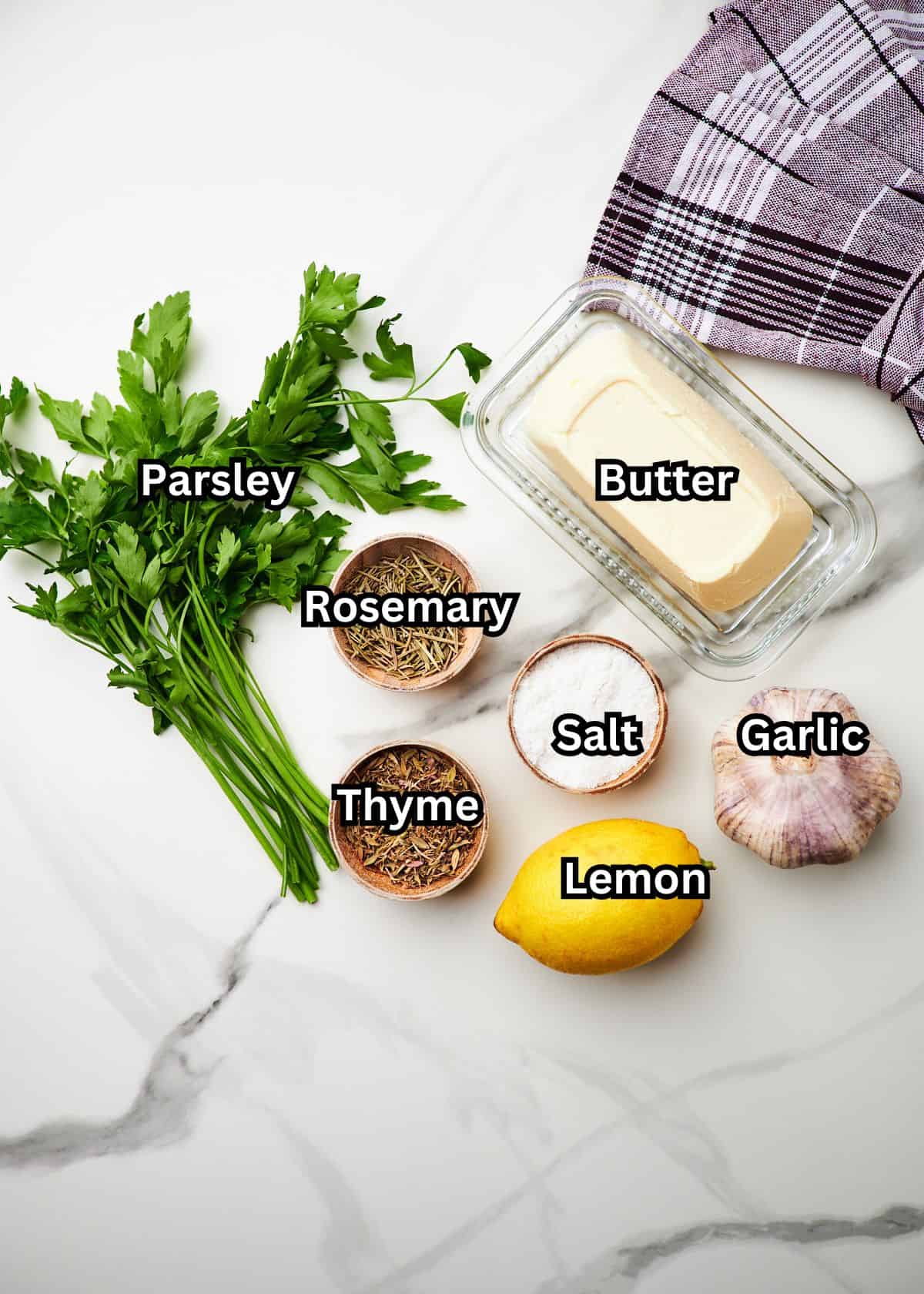 ingredients for roasted garlic butter seasoning on countertop.