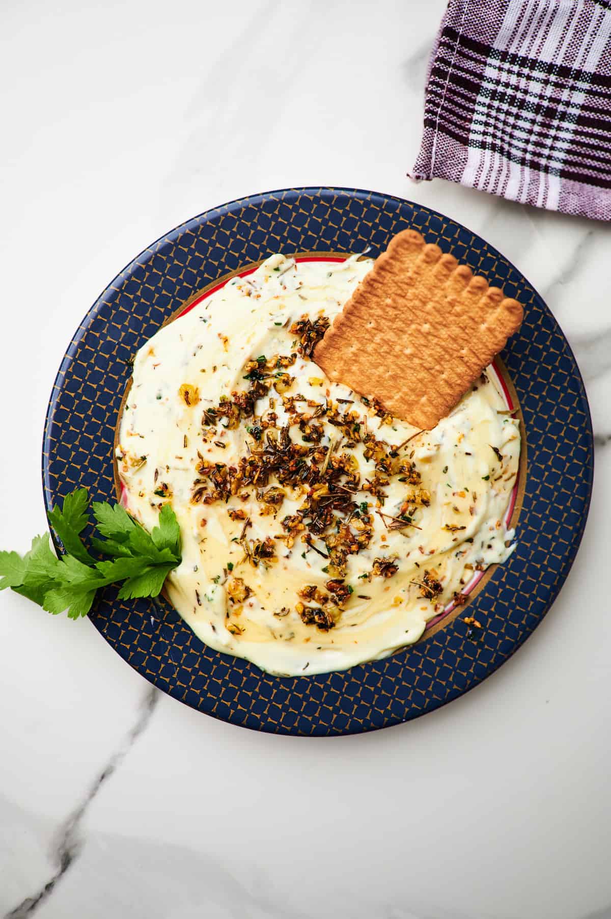 bisquit dipping into whipped brie cheese