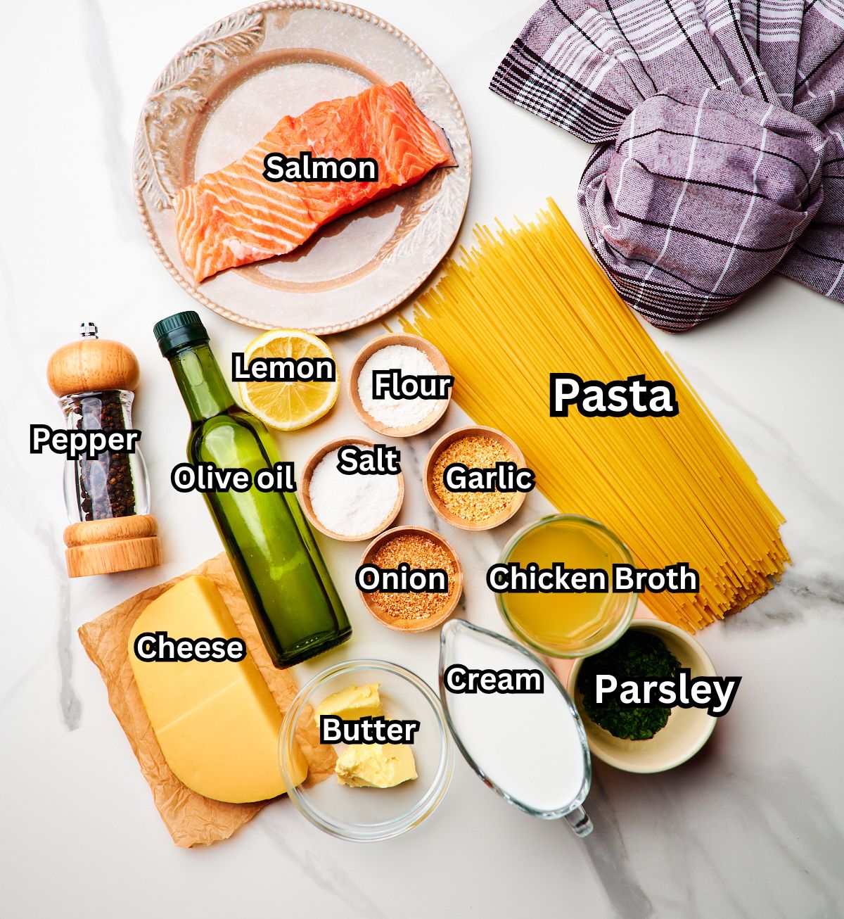 process shot of ingredient quantities in dishes for making creamy salmon pasta with a garlic sauce